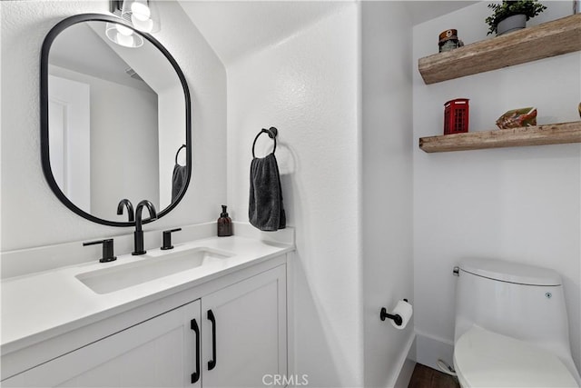 1225 Via Presa, San Clemente, CA 92672 - bathroom with toilet, vanity, baseboards, and wood finished floors
