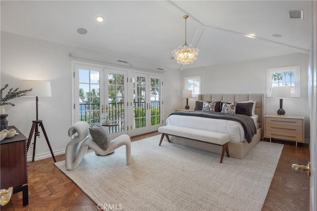 bedroom with multiple windows, access to outside, french doors, a chandelier, and lofted ceiling