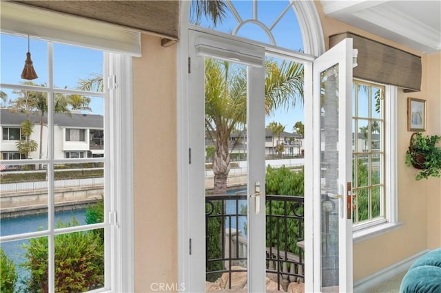 842 Harbor Island Dr, Newport Beach, CA 92660 - doorway to outside with a water view, plenty of natural light, and baseboards