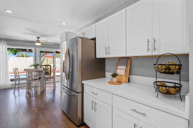 3883 Mount Everest Blvd, San Diego, CA 92111 - kitchen featuring a ceiling fan, light countertops, dark wood-style flooring, white cabinets, and stainless steel fridge