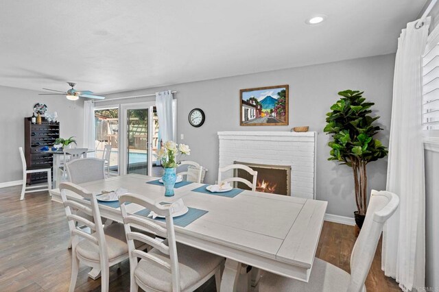 3883 Mount Everest Blvd, San Diego, CA 92111 - dining room with a ceiling fan, wood finished floors, baseboards, recessed lighting, and a brick fireplace