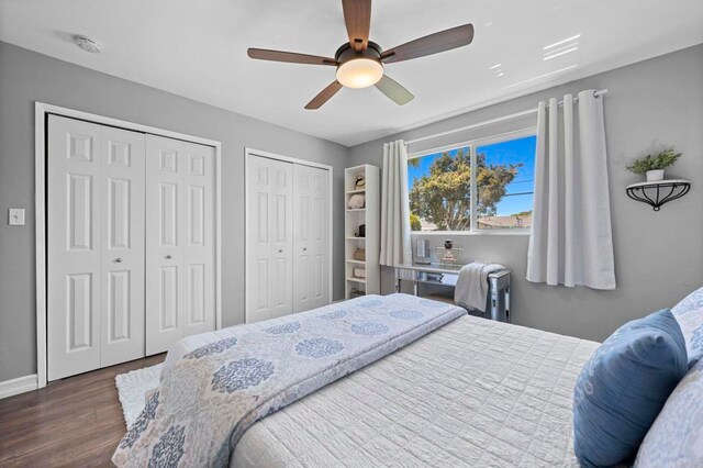 3883 Mount Everest Blvd, San Diego, CA 92111 - bedroom featuring dark wood-style floors, multiple closets, baseboards, and a ceiling fan