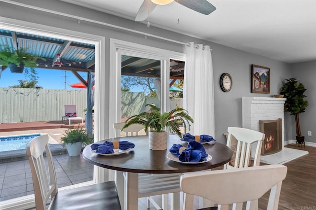 3883 Mount Everest Blvd, San Diego, CA 92111 - dining area with plenty of natural light, ceiling fan, wood finished floors, and a fireplace