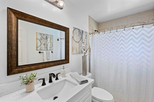 3883 Mount Everest Blvd, San Diego, CA 92111 - bathroom featuring vanity, toilet, and a shower with shower curtain