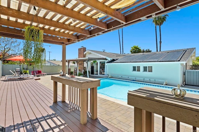 3883 Mount Everest Blvd, San Diego, CA 92111 - view of pool with a wooden deck, a pergola, and a fenced backyard