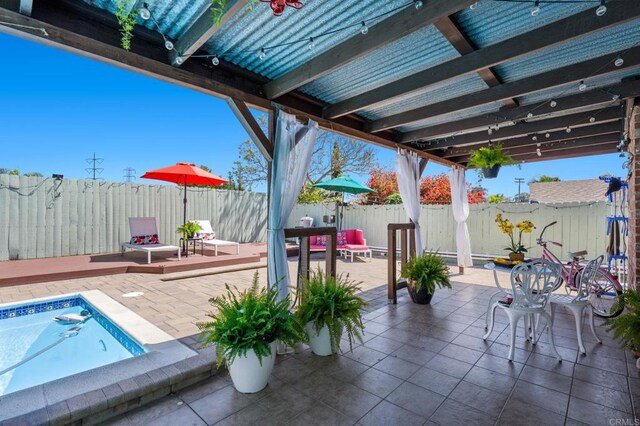 3883 Mount Everest Blvd, San Diego, CA 92111 - fenced backyard with a deck and a patio area