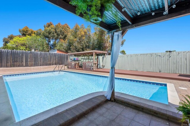 3883 Mount Everest Blvd, San Diego, CA 92111 - view of swimming pool with a fenced backyard and a patio