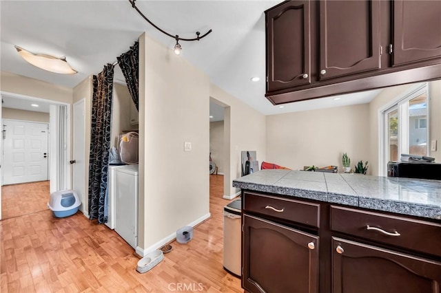 3862 Pimlico Dr, Pleasanton, CA 94588 - kitchen with tile counters, dark brown cabinets, light wood-style floors, and baseboards