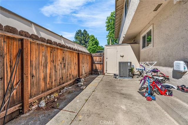 3862 Pimlico Dr, Pleasanton, CA 94588 - view of patio featuring central AC, fence, and a gate