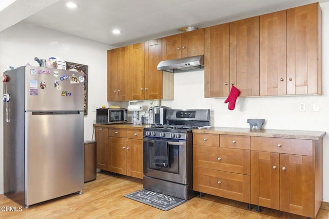 320 D St, Fillmore, CA 93015 - kitchen featuring stainless steel appliances, ventilation hood, light wood-style flooring, brown cabinets, and recessed lighting