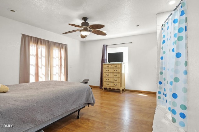 320 D St, Fillmore, CA 93015 - bedroom featuring wood finished floors, baseboards, a textured ceiling, and ceiling fan
