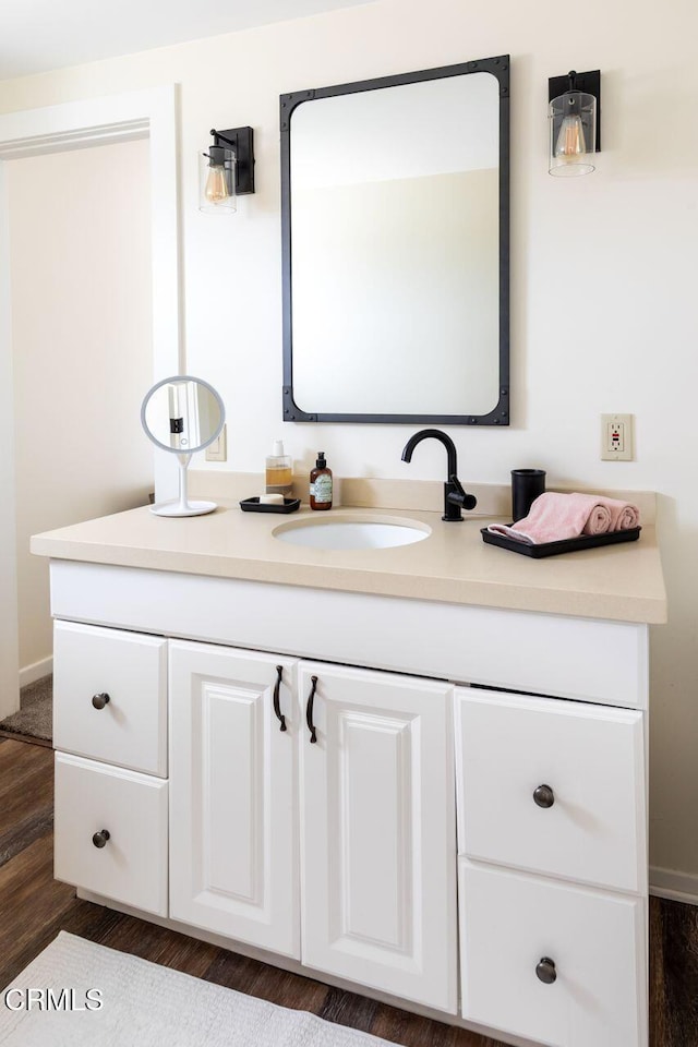 bathroom featuring vanity and wood finished floors