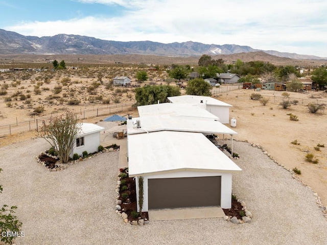 overview of rural landscape with a mountain backdrop and a desert landscape