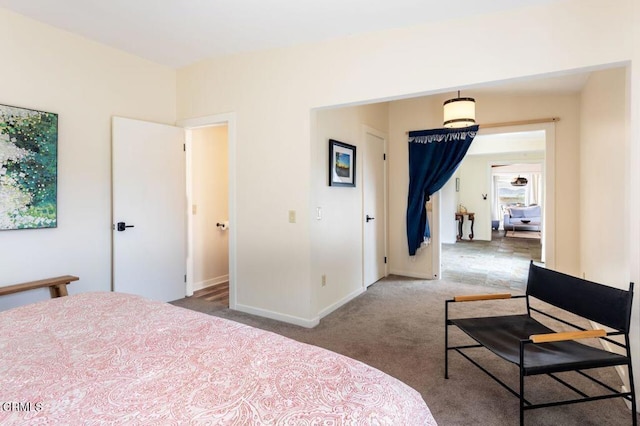 carpeted bedroom with baseboards