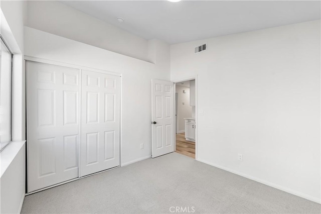 1032 Glenn Ct, Lancaster, CA 93535 - unfurnished bedroom featuring carpet, baseboards, and a closet