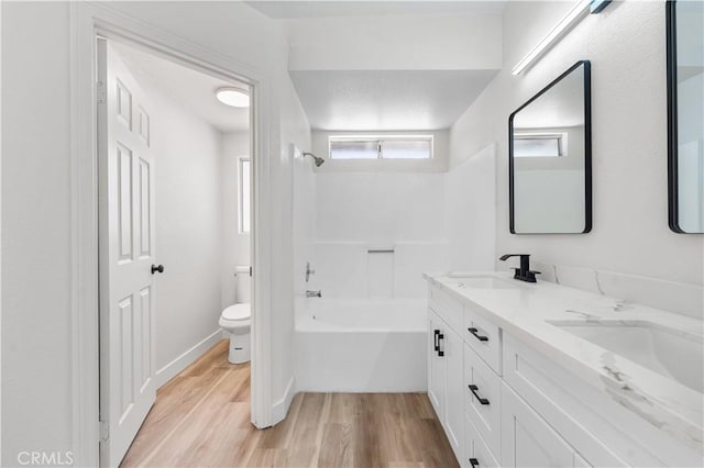1032 Glenn Ct, Lancaster, CA 93535 - bathroom with wood finished floors, toilet, double vanity, and shower / tub combination