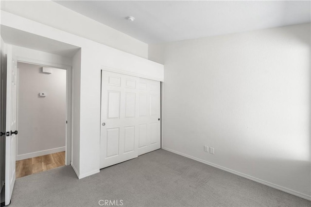 1032 Glenn Ct, Lancaster, CA 93535 - unfurnished bedroom with carpet flooring, baseboards, and a closet
