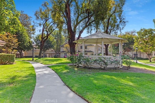 view of property's community with a gazebo and a lawn