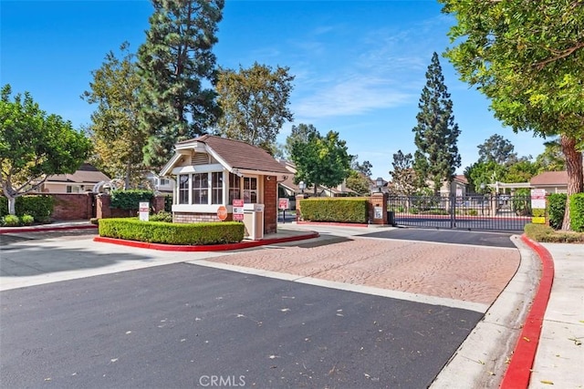 view of community with a gate and fence