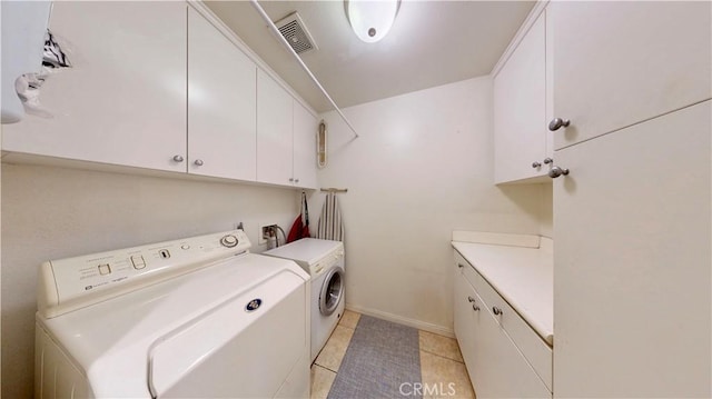 29456 Green Side Ct, Murrieta, CA 92563 - washroom featuring cabinet space, washer and clothes dryer, light tile patterned flooring, and baseboards