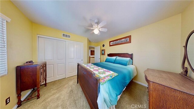 29456 Green Side Ct, Murrieta, CA 92563 - bedroom with a closet, light carpet, ceiling fan, and baseboards