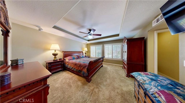 29456 Green Side Ct, Murrieta, CA 92563 - carpeted bedroom featuring a raised ceiling, a textured ceiling, baseboards, and a ceiling fan