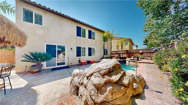 29456 Green Side Ct, Murrieta, CA 92563 - rear view of house with stucco siding, a patio area, a fenced backyard, and a tile roof