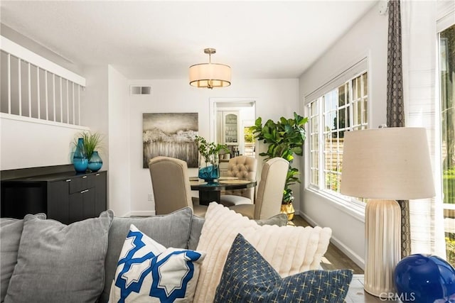 living room with wood finished floors and baseboards