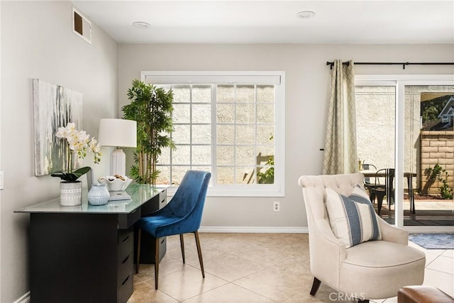 office featuring baseboards and light tile patterned flooring