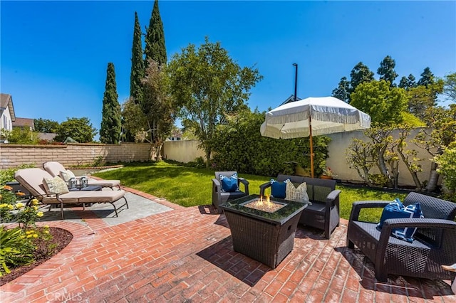 view of patio / terrace featuring an outdoor living space with a fire pit