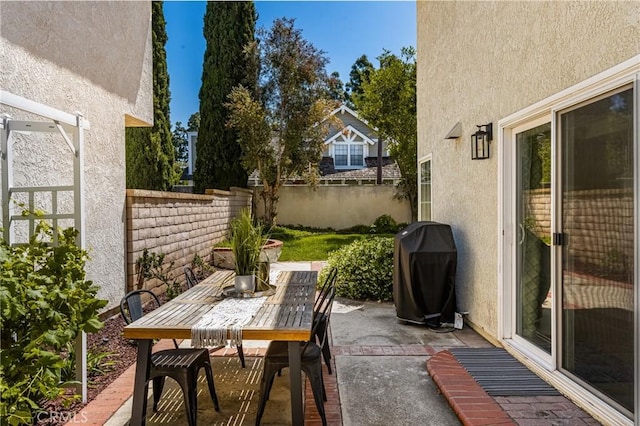 view of patio / terrace featuring a fenced backyard, outdoor dining area, and grilling area
