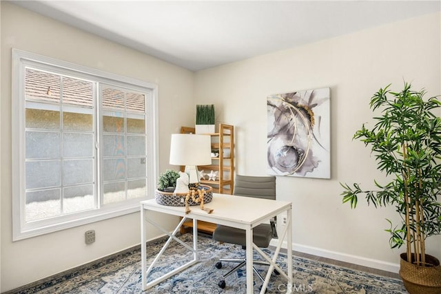 office with plenty of natural light and baseboards