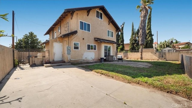 4536 N Irwindale Ave, Covina, CA 91722 - rear view of house with stucco siding, a patio, and a gate