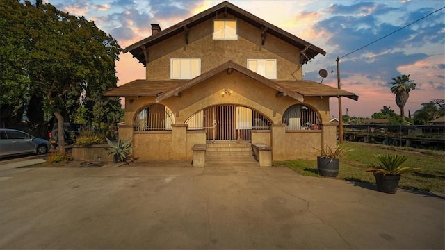 4536 N Irwindale Ave, Covina, CA 91722 - view of front of property featuring a fenced front yard, stucco siding, and a chimney