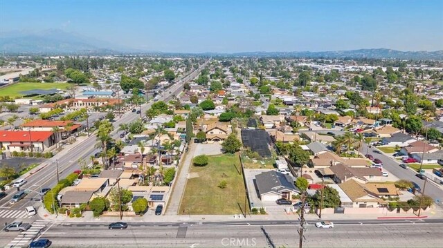 4536 N Irwindale Ave, Covina, CA 91722 - aerial view of property and surrounding area with mountains and nearby suburban area
