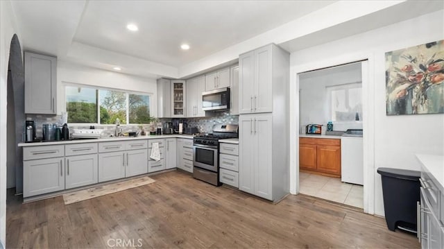 4536 N Irwindale Ave, Covina, CA 91722 - kitchen with stainless steel appliances, gray cabinetry, a sink, tasteful backsplash, and recessed lighting