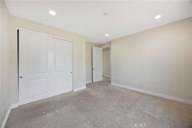 51 Carrington, Irvine, CA 92620 - unfurnished bedroom featuring carpet flooring, a closet, and recessed lighting