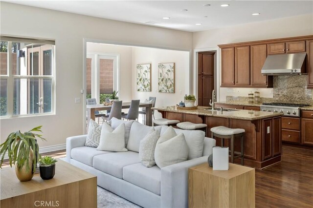 51 Carrington, Irvine, CA 92620 - living room with dark wood-style flooring and recessed lighting