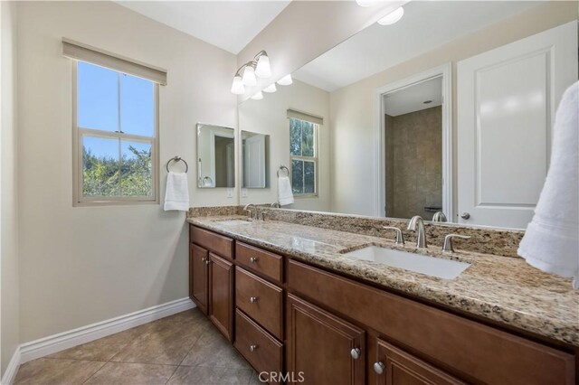 51 Carrington, Irvine, CA 92620 - bathroom featuring double vanity and tile patterned floors