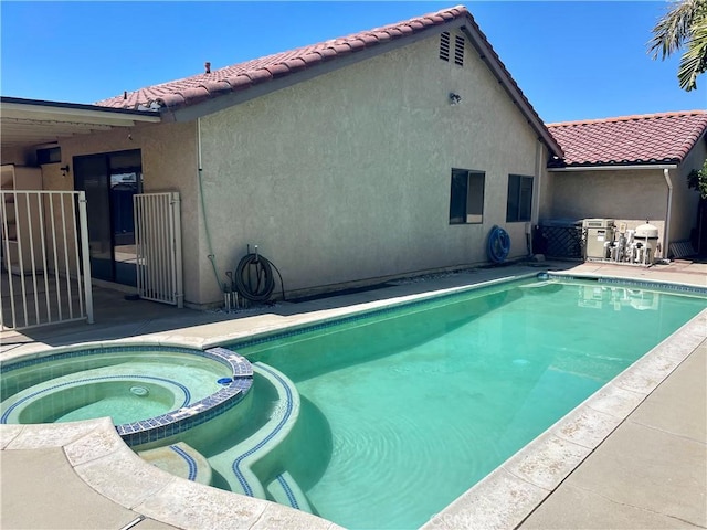 view of pool featuring a pool with connected hot tub