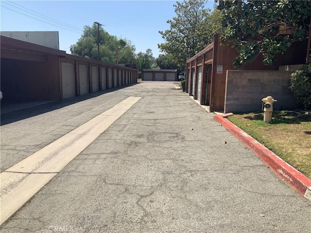 view of road with community garages