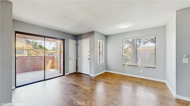 9020 Newport Ave Unit 17, Fontana, CA 92335 - empty room with wood finished floors and baseboards
