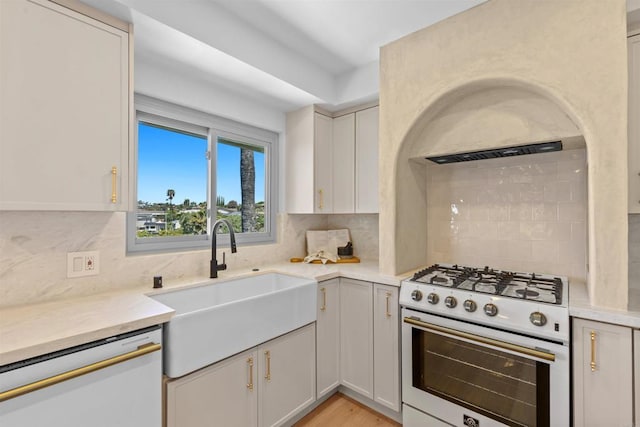 5740 Daffodil Ln, San Diego, CA 92120 - kitchen with white appliances, decorative backsplash, a sink, and light countertops