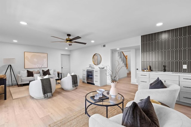 5740 Daffodil Ln, San Diego, CA 92120 - living area with wine cooler, stairs, light wood finished floors, ceiling fan, and recessed lighting