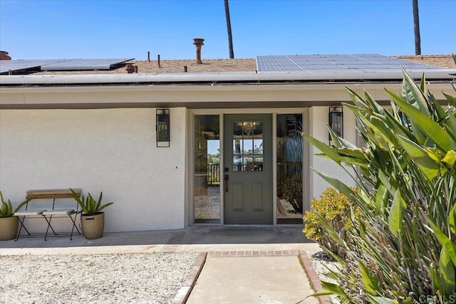 5740 Daffodil Ln, San Diego, CA 92120 - property entrance featuring stucco siding and solar panels