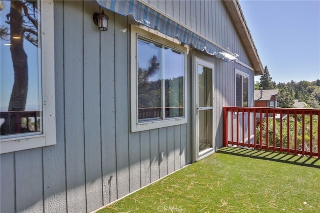 view of side of property with a yard