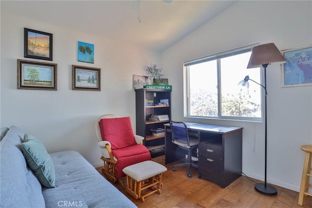 home office with wood finished floors, vaulted ceiling, and ceiling fan