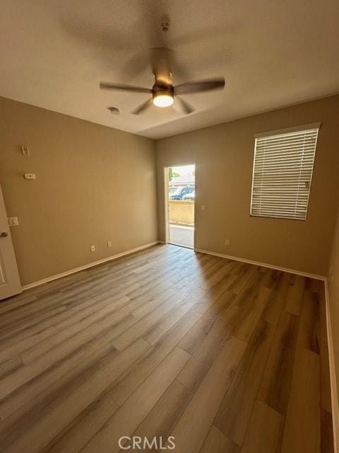 31256 Taylor Ln, Temecula, CA 92592 - empty room featuring ceiling fan, wood finished floors, and baseboards