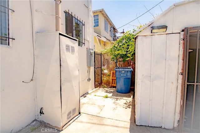 view of shed featuring fence
