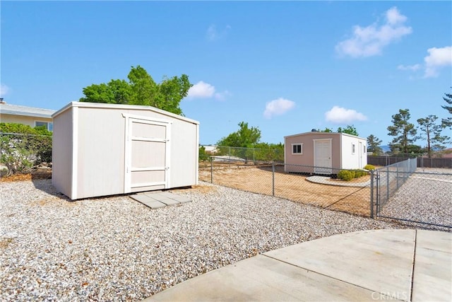 19115 Seneca, Apple Valley, CA 92307 - fenced yard featuring a storage unit and an outdoor structure